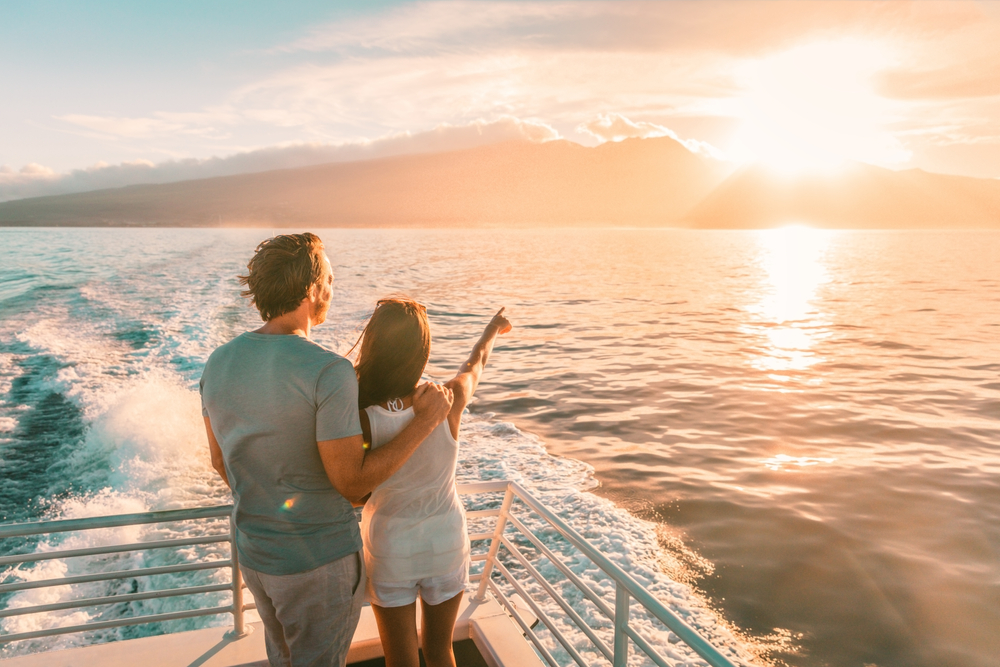 couple on a boat trip with sunset